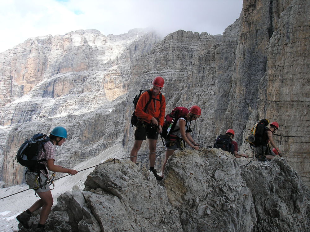Close-up view of mountaineers on a knife-edge ridge